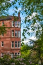 Red Sandstone Tenement in Glasgow With Gardens in the Foreground Royalty Free Stock Photo