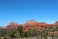 The red sandstone and white limestone mountains of Sedona with evergreens, yuccas, and dried grasses Royalty Free Stock Photo