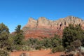 The red sandstone and white limestone mountains of Sedona with evergreens, yuccas and dry scrub brush Royalty Free Stock Photo