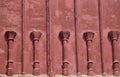 Red sanstone wall with pillars