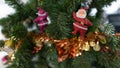 Red Santa doll is an ornament on a Christmas tree Royalty Free Stock Photo