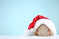 Red santa hat with house model Royalty Free Stock Photo