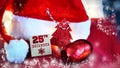 Red Santa Hat with paper tag of Christmas date Royalty Free Stock Photo