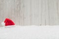 Red Santa hat in the snow