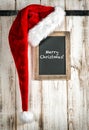 Red Santa hat and vintage chalkboard. Christmas decoration