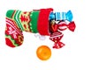 Red santa stocking with three decorative sweets inside and and m