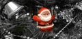 Red santa toy on Christmas tree Royalty Free Stock Photo