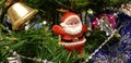 Red santa toy on Christmas tree Royalty Free Stock Photo