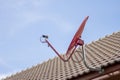 The Red satellite dish on the roof Royalty Free Stock Photo