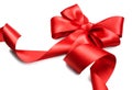Red satin gift bow. Red ribbon isolated on white Royalty Free Stock Photo