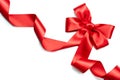 Red satin gift bow. Red ribbon isolated on white Royalty Free Stock Photo