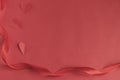 Red satin ribbon on a red background and heart. Valentine`s day for Valentine`s Day. Love Royalty Free Stock Photo