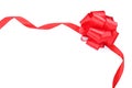 Red satin ribbon with bow on white background, top view Royalty Free Stock Photo