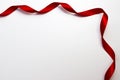 The red satin ribbon is in a corner of the page Royalty Free Stock Photo