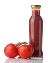 Red sauce in a bottle and fresh tomatoes on a white isolated background. Tomato sauce. Ketchup Royalty Free Stock Photo