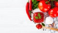 Red sauce or ketchup in a glass bowl and ingredients for his cooking, tomatoes, garlic, basil, parsley, red hot pepper and spices Royalty Free Stock Photo