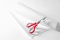 Red scissors and paper on white background. Space for text Royalty Free Stock Photo