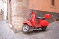 Red scooter alleyway cityscape Rome Italy