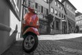 Red scooter on medieval town empty street Royalty Free Stock Photo