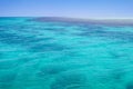 Red Sea background, clean blue water, small waves, coral reef