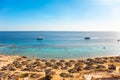 Red sea beach from aerial top view. Tourists relaxing under umbrellas Royalty Free Stock Photo