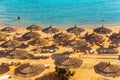 Red sea beach from aerial top view. Tourists relaxing under umbrellas Royalty Free Stock Photo