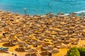 Red sea beach from aerial top view. Tourists relaxing under umbrellas Royalty Free Stock Photo