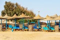 Red Sea Beach with Straw Umbrellas and Deck Chairs - Marsa Alam Egypt Africa Royalty Free Stock Photo