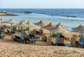 Red Sea Beach with Straw Umbrellas and Deck Chairs - Marsa Alam Egypt Africa Royalty Free Stock Photo