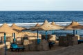 Red Sea beach with straw umbrellas - Marsa Alam Egypt Africa Royalty Free Stock Photo