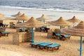 Red Sea beach with straw umbrellas - Marsa Alam Egypt Africa Royalty Free Stock Photo