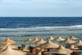 Red Sea beach with straw umbrellas - Marsa Alam Egypt Africa Royalty Free Stock Photo