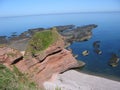Red sea cliffs near Arbroath Royalty Free Stock Photo