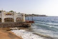 Red Sea coast, view of restaurant over sandy beach, Dahab, Egypt Royalty Free Stock Photo