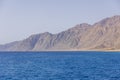 The Red Sea on the Gulf of Aqaba, surrounded by the mountains of the Sinai Peninsula, Dahab, Egypt Royalty Free Stock Photo