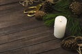 Red seasonal viburnum berries, white candle, fresh fir branches, cones and glass bottle of aromatic oils on the wooden table.Conce Royalty Free Stock Photo