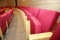 Red seats in the auditorium quietly and without people . Rows of red velvet theater seats in an old Vaudeville style theater. Royalty Free Stock Photo