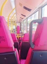 Red seats inside the empty bus on the road Hong Kong Royalty Free Stock Photo