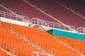 Red seats on stadium steps bleacher Royalty Free Stock Photo