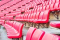 Red seats on stadium steps bleacher Royalty Free Stock Photo