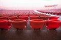 Red seats in unrecgonizable sports stadium Royalty Free Stock Photo