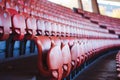 Red seats in unrecgonizable sports stadium Royalty Free Stock Photo