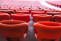 Red seats in unrecgonizable sports stadium Royalty Free Stock Photo