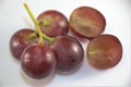 Red seedless grapes on white Royalty Free Stock Photo