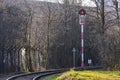 A red semaphore signal on a single-track railroad that turns rig Royalty Free Stock Photo