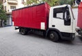 Red semi-trailer trucks parked at city center Royalty Free Stock Photo