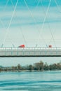 Red semi-truck crossing the bridge over Danube river in Novi Sad Royalty Free Stock Photo