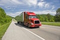 Red Semi Truck On Interstate In Springtime Royalty Free Stock Photo