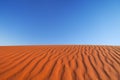 Red sand dune on a clear day, Northern Territory, Australia Royalty Free Stock Photo