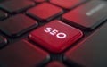 Red SEO key on computer keyboard. Conceptual image for search engine optimization. Royalty Free Stock Photo